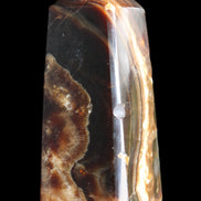Chocolate Calcite obelisk 78*31*28mm 145g in sunlight - Rocks and Things Store