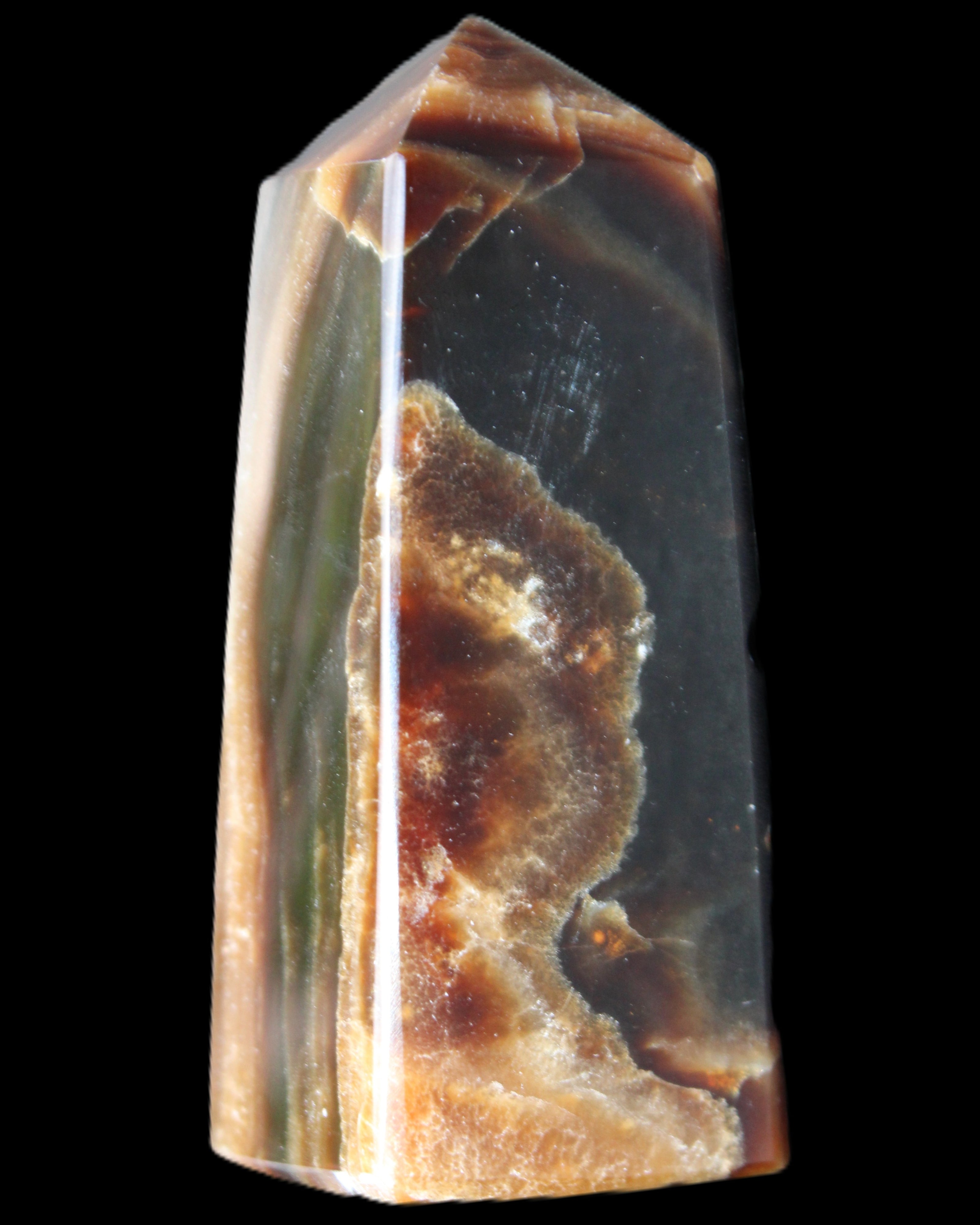 Chocolate Calcite obelisk 78*31*28mm 145g in sunlight - Rocks and Things Store