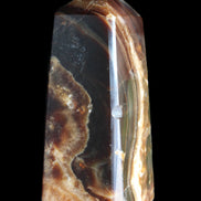 Chocolate Calcite obelisk 78*31*28mm 145g in sunlight - Rocks and Things Store