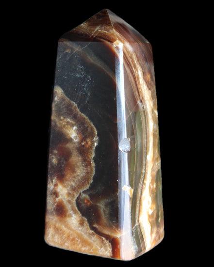 Chocolate Calcite obelisk 78*31*28mm 145g in sunlight - Rocks and Things Store