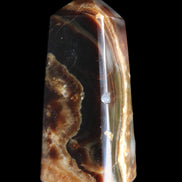 Chocolate Calcite obelisk 78*31*28mm 145g in sunlight - Rocks and Things Store