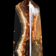 Chocolate Calcite obelisk 78*31*28mm 145g in sunlight - Rocks and Things Store
