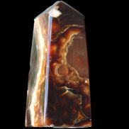Chocolate Calcite obelisk 78*31*28mm 145g in sunlight - Rocks and Things Store