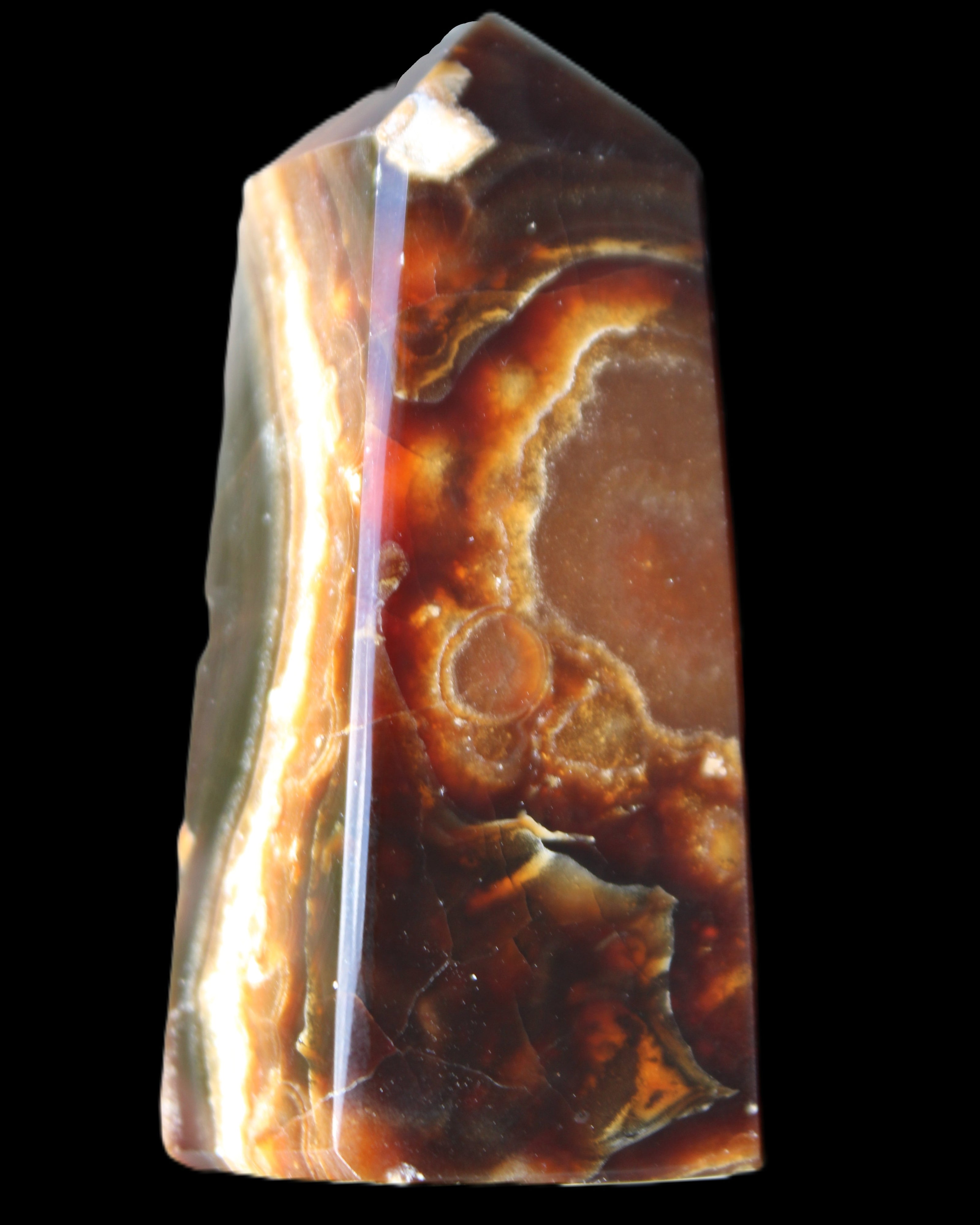 Chocolate Calcite obelisk 78*31*28mm 145g in sunlight - Rocks and Things Store