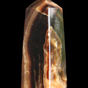 Chocolate Calcite obelisk 78*31*28mm 145g in sunlight - Rocks and Things Store