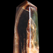 Chocolate Calcite obelisk 78*31*28mm 145g in sunlight - Rocks and Things Store