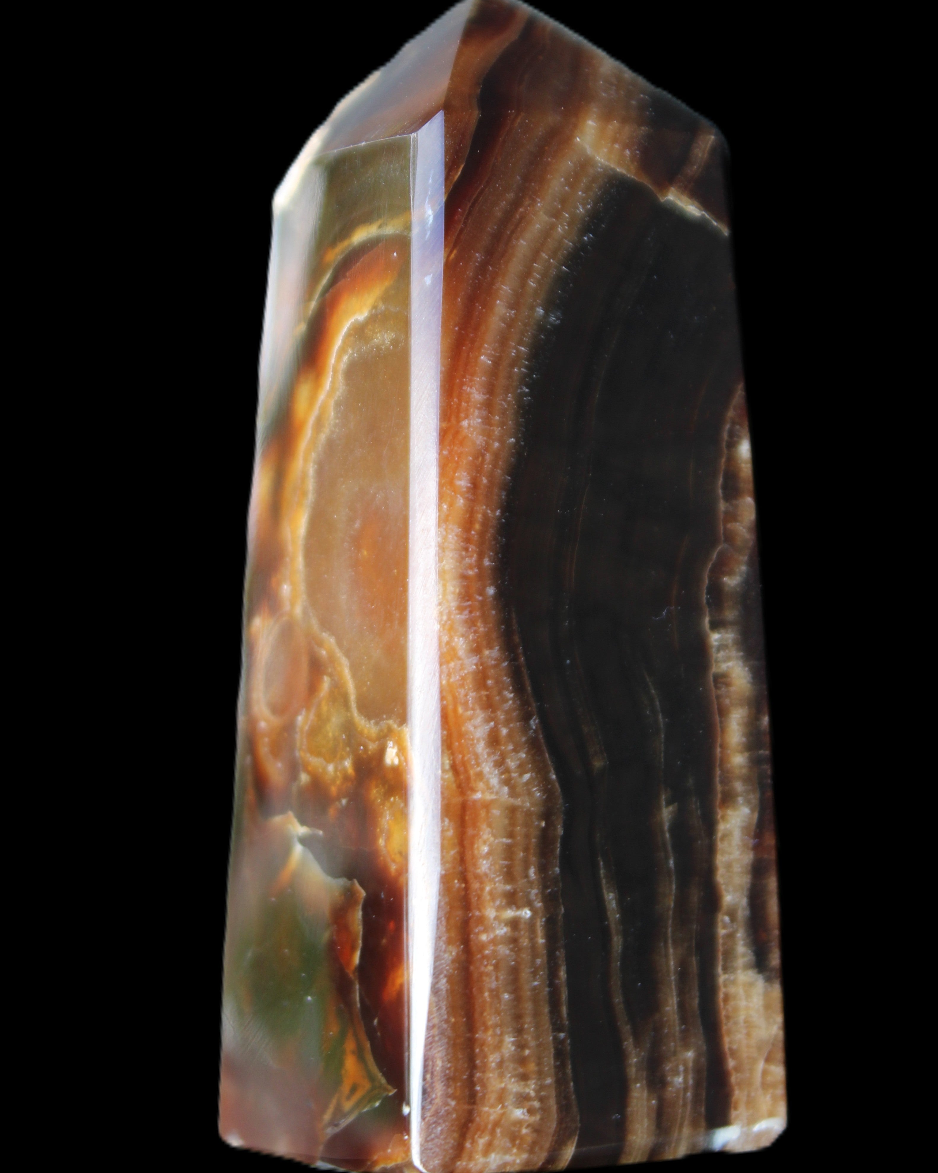 Chocolate Calcite obelisk 78*31*28mm 145g in sunlight - Rocks and Things Store