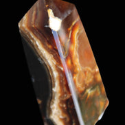 Chocolate Calcite obelisk 78*31*28mm 145g in sunlight - Rocks and Things Store