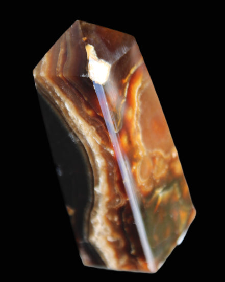 Chocolate Calcite obelisk 78*31*28mm 145g in sunlight - Rocks and Things Store