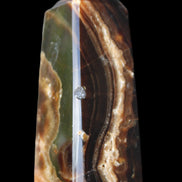 Chocolate Calcite obelisk 78*31*28mm 145g in sunlight - Rocks and Things Store