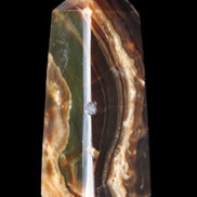 Chocolate Calcite obelisk 78*31*28mm 145g in sunlight - Rocks and Things Store