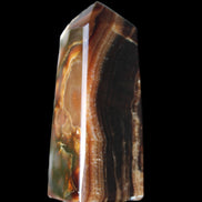 Chocolate Calcite obelisk 78*31*28mm 145g in sunlight - Rocks and Things Store