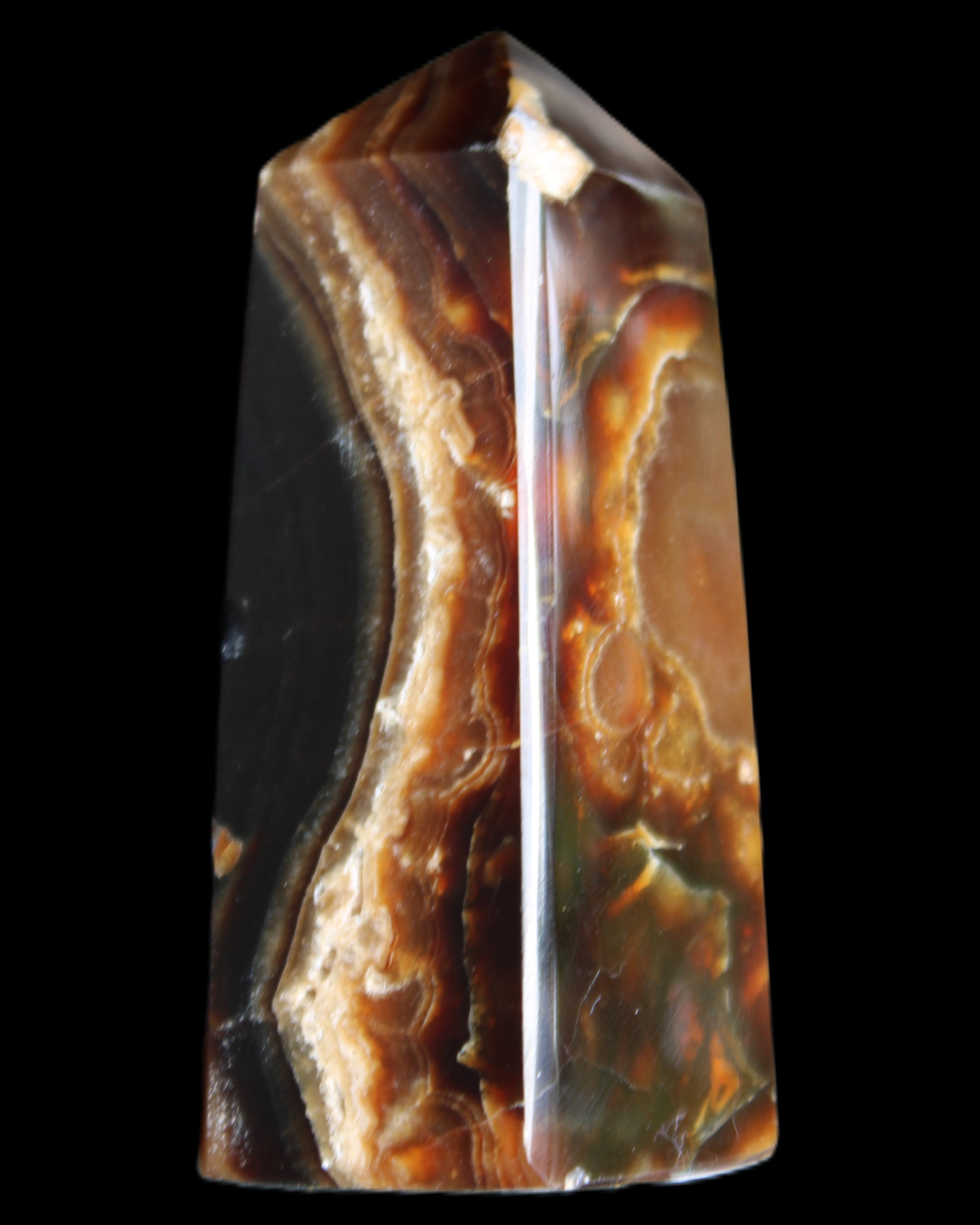 Chocolate Calcite obelisk 78*31*28mm 145g in sunlight - Rocks and Things Store