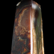 Chocolate Calcite obelisk 78*31*28mm 145g in sunlight - Rocks and Things Store