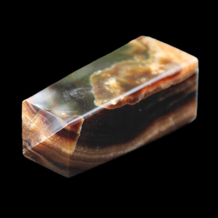 Chocolate Calcite obelisk 78*31*28mm 145g in sunlight - Rocks and Things Store