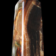 Chocolate Calcite obelisk 78*31*28mm 145g in sunlight - Rocks and Things Store