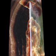 Chocolate Calcite obelisk 78*31*28mm 145g in sunlight - Rocks and Things Store