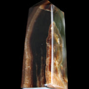 Chocolate Calcite obelisk 78*31*28mm 145g in sunlight - Rocks and Things Store