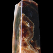 Chocolate Calcite obelisk 78*31*28mm 145g in sunlight - Rocks and Things Store