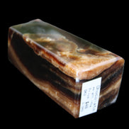 Chocolate Calcite obelisk 78*31*28mm 145g in sunlight - Rocks and Things Store