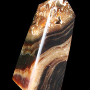 Chocolate Calcite obelisk 83*32*30mm 147.5g in sunlight - Rocks and Things Store