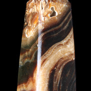 Chocolate Calcite obelisk 83*32*30mm 147.5g in sunlight - Rocks and Things Store