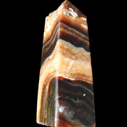Chocolate Calcite obelisk 83*32*30mm 147.5g in sunlight - Rocks and Things Store