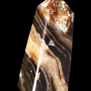 Chocolate Calcite obelisk 83*32*30mm 147.5g in sunlight - Rocks and Things Store