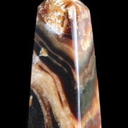 Chocolate Calcite obelisk 83*32*30mm 147.5g in sunlight - Rocks and Things Store