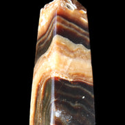 Chocolate Calcite obelisk 83*32*30mm 147.5g in sunlight - Rocks and Things Store