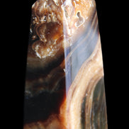 Chocolate Calcite obelisk 83*32*30mm 147.5g in sunlight - Rocks and Things Store