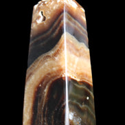 Chocolate Calcite obelisk 83*32*30mm 147.5g in sunlight - Rocks and Things Store