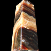 Chocolate Calcite obelisk 83*32*30mm 147.5g in sunlight - Rocks and Things Store