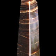 Chocolate Calcite obelisk 87*24*22mm 90.8g in sunlight - Rocks and Things Store