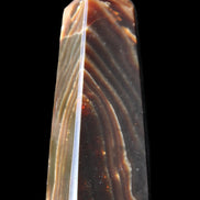 Chocolate Calcite obelisk 78*29*18mm 84g in sunlight - Rocks and Things Store