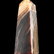 Chocolate Calcite obelisk 78*29*18mm 84g in sunlight - Rocks and Things Store