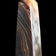 Chocolate Calcite obelisk 78*29*18mm 84g in sunlight - Rocks and Things Store