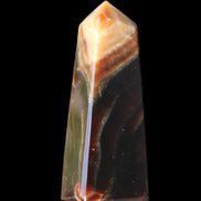 Chocolate Calcite obelisk 78*29*18mm 84g in sunlight - Rocks and Things Store