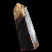 Chocolate Calcite obelisk 78*29*18mm 84g in sunlight - Rocks and Things Store