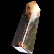Chocolate Calcite obelisk 78*29*18mm 84g in sunlight - Rocks and Things Store