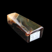 Chocolate Calcite obelisk 78*29*18mm 84g in sunlight - Rocks and Things Store