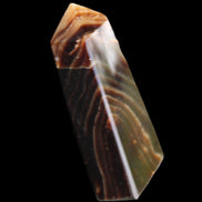 Chocolate Calcite obelisk 78*29*18mm 84g in sunlight - Rocks and Things Store