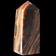 Chocolate Calcite obelisk 62*25*21mm 73g in sunlight - Rocks and Things Store