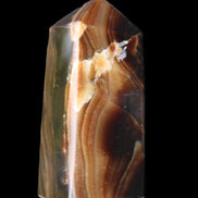 Chocolate Calcite obelisk 62*25*21mm 73g in sunlight - Rocks and Things Store