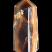 Chocolate Calcite obelisk 62*25*21mm 73g in sunlight - Rocks and Things Store