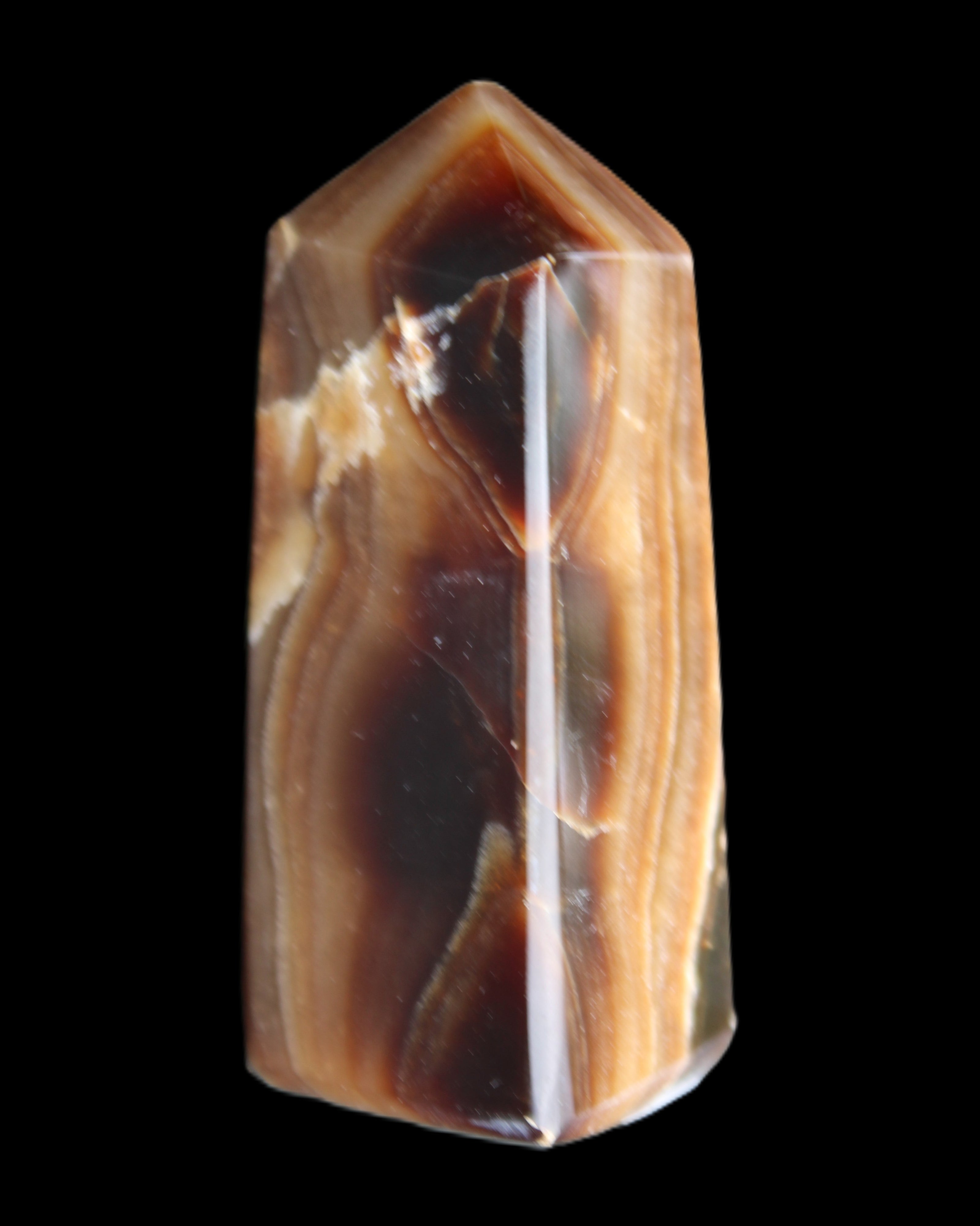 Chocolate Calcite obelisk 62*25*21mm 73g in sunlight - Rocks and Things Store