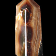 Chocolate Calcite obelisk 62*25*21mm 73g in sunlight - Rocks and Things Store