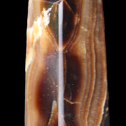 Chocolate Calcite obelisk 62*25*21mm 73g in sunlight - Rocks and Things Store