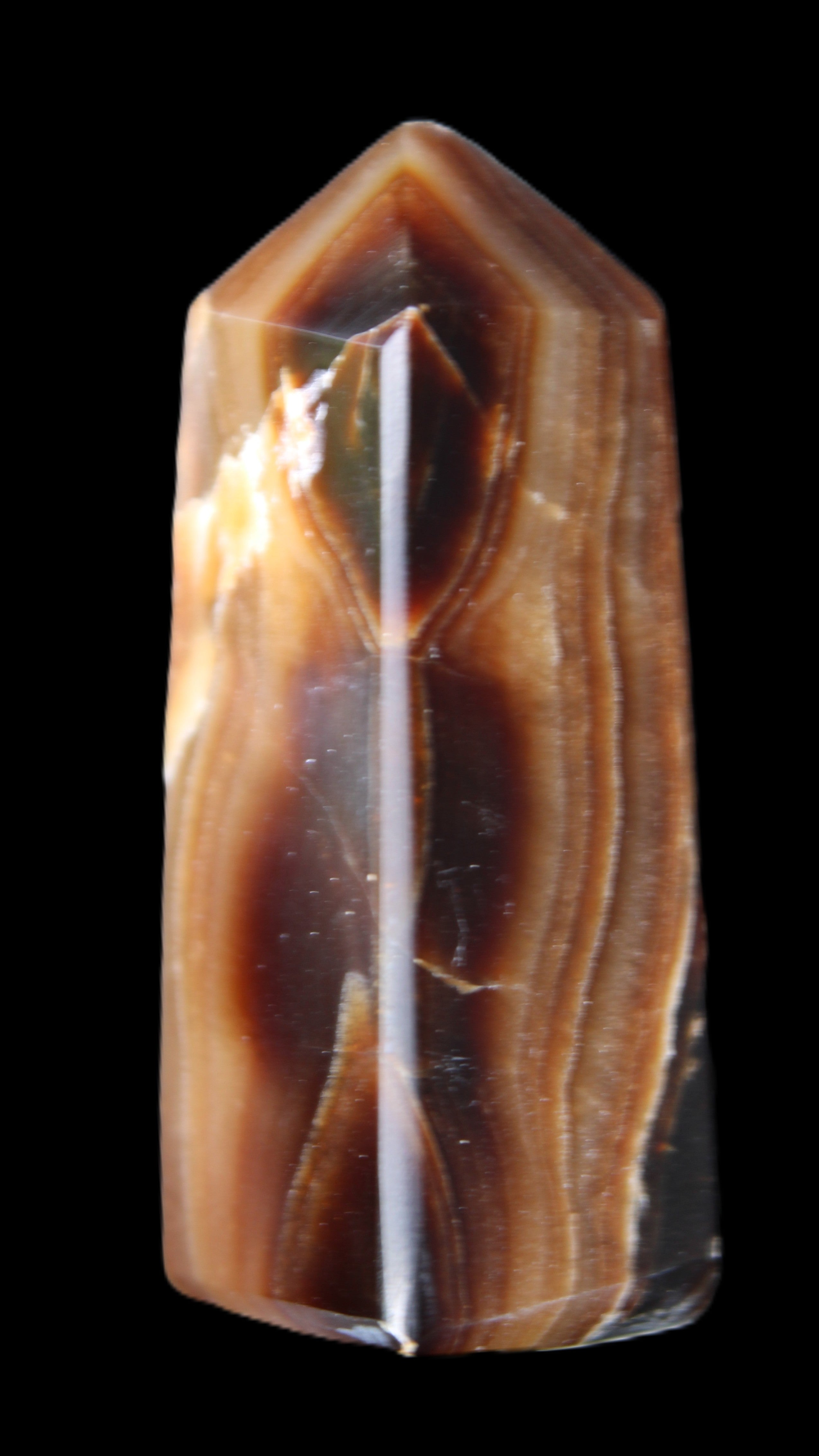 Chocolate Calcite obelisk 62*25*21mm 73g in sunlight - Rocks and Things Store