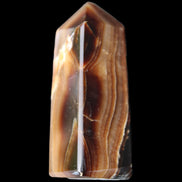 Chocolate Calcite obelisk 62*25*21mm 73g in sunlight - Rocks and Things Store